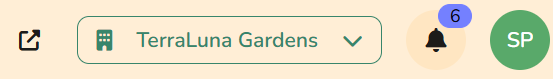 Top bar showing organization dropdown, notification bell, and user account menu